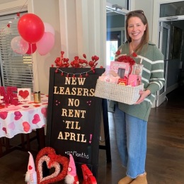 a woman holding a gift basket