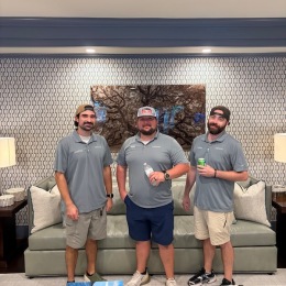 three men posing for a picture
