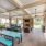 covered patio with fireplace and eating areas